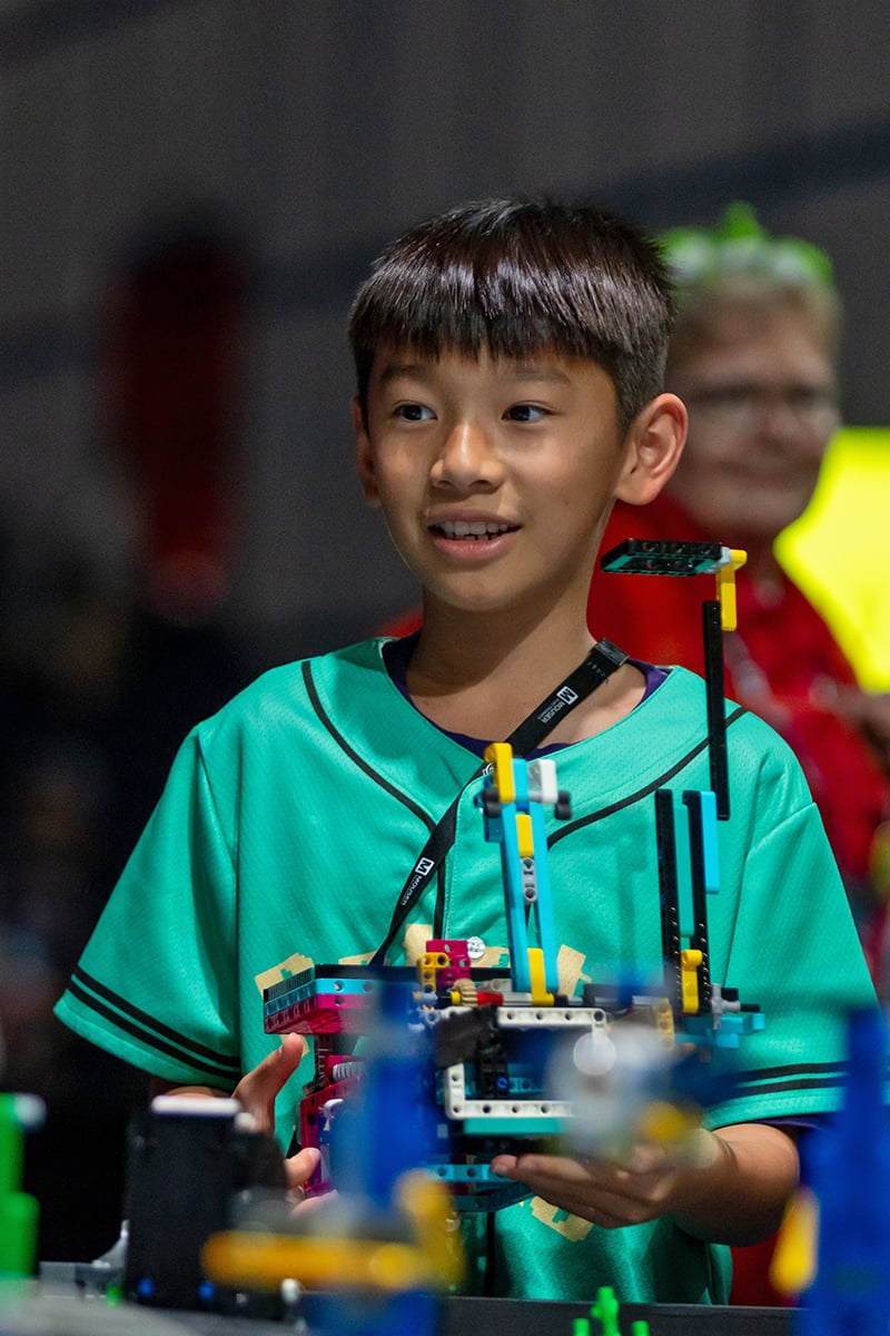 FIRST LEGO League student cheering on their robot at FIRST Championship.