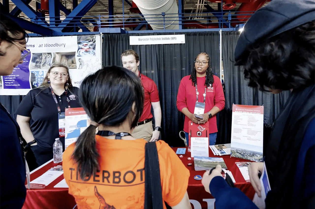 People gather at the WPI booth at FIRST Championship